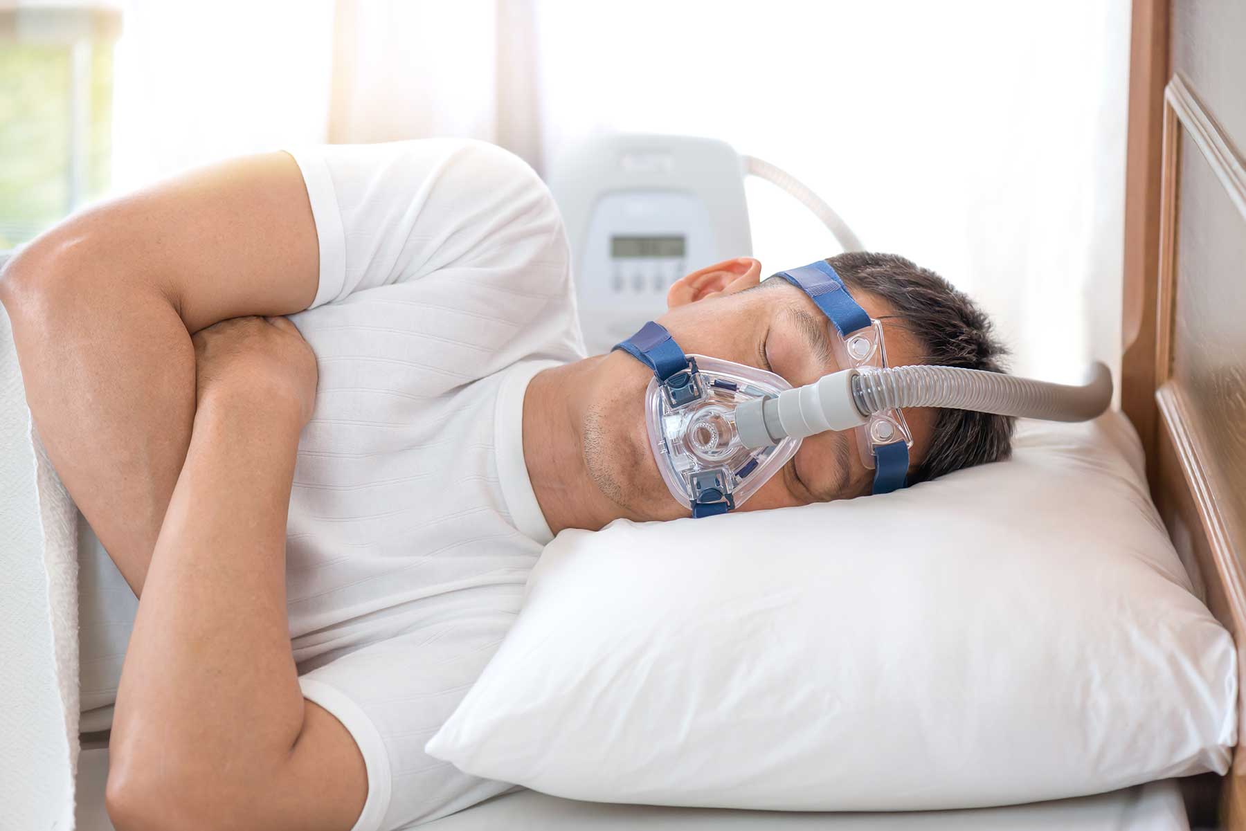 Snoring Solutions Compared - Man wearing CPAP Mask
